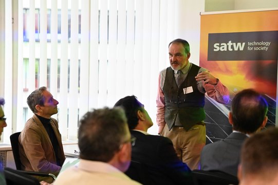 Lecturer speaks to an audience at SATW event