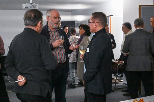 People chatting at a reception