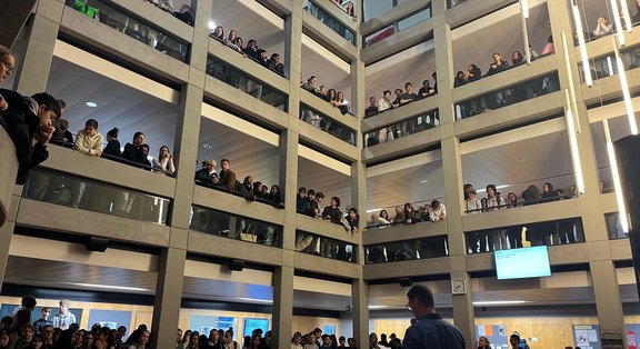 Multi-storey atrium full of spectators